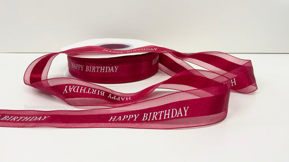 Red “Happy Birthday” ribbon